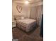 Comfortable bedroom with plush carpet and a nicely decorated bed at 945 Bethany Rd, Covington, GA 30016