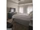 Spacious main bedroom with tray ceilings, carpet, and a large window at 945 Bethany Rd, Covington, GA 30016