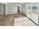 Open dining room featuring a neutral paint palette, tile floors and slider access to the back patio at 12 Bonnie Glen Ln, Hampton, GA 30228