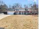 Charming single Gathering home featuring a brick exterior and a well-maintained front yard at 12 Bonnie Glen Ln, Hampton, GA 30228