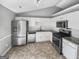 Well-lit kitchen with stainless steel appliances, granite countertops, and ample cabinet space at 12 Bonnie Glen Ln, Hampton, GA 30228