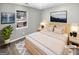 Inviting main bedroom with a comfortable bed, soft lighting, and a picturesque view of the outdoors at 12 Bonnie Glen Ln, Hampton, GA 30228