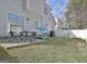 Fenced backyard with a table and chairs at 747 S Fairfield Dr, Peachtree City, GA 30269