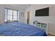 Bright bedroom featuring wood floors, vaulted ceilings, and a television at 747 S Fairfield Dr, Peachtree City, GA 30269