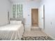 Inviting bedroom with neutral tones, leading to a functional space at 747 S Fairfield Dr, Peachtree City, GA 30269