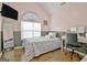Cozy bedroom with a large window, vanity, and a full-length mirror at 747 S Fairfield Dr, Peachtree City, GA 30269