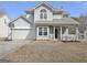 Charming two-story home with covered front porch and attached two-car garage at 747 S Fairfield Dr, Peachtree City, GA 30269