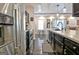 Well-equipped kitchen featuring black cabinetry and stainless steel appliances at 747 S Fairfield Dr, Peachtree City, GA 30269