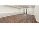 Spacious finished basement with wood-look floors, neutral walls, and recessed lighting at 4421 Paradise Cir, Vinings, GA 30339