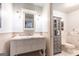 Bright bathroom with a pedestal sink, medicine cabinet, and classic design at 4421 Paradise Cir, Vinings, GA 30339