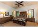 Bedroom with ceiling fan, windows and rustic wooden headboard at 4421 Paradise Cir, Vinings, GA 30339