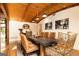 Dining room featuring wood ceilings, pendant lighting, and seating for eight at 4421 Paradise Cir, Vinings, GA 30339
