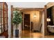 Entryway with hardwood floors, wood beam archway, and decorative tree at 4421 Paradise Cir, Vinings, GA 30339