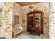 Charming entryway with stone accents, double doors, and a cozy bench, creating an inviting welcome at 4421 Paradise Cir, Vinings, GA 30339