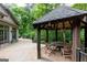Gazebo and patio adjacent to the house, ideal for outdoor relaxation and gatherings at 4421 Paradise Cir, Vinings, GA 30339