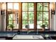 Kitchen with a farmhouse sink and a window with a wooded view flanked by lamps at 4421 Paradise Cir, Vinings, GA 30339