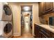 Well-equipped laundry room with stainless steel washer/dryer and access to the walk-in closet at 4421 Paradise Cir, Vinings, GA 30339