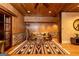 Inviting living room with wood paneled walls, a stylish rug, and comfortable seating at 4421 Paradise Cir, Vinings, GA 30339
