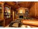Living room with fireplace, built-in bookshelves, and leather furniture at 4421 Paradise Cir, Vinings, GA 30339