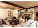 Spacious living room featuring a stone fireplace and plush sectional sofa at 4421 Paradise Cir, Vinings, GA 30339