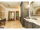 Elegant main bathroom featuring a large mirror and tiled floors at 4421 Paradise Cir, Vinings, GA 30339