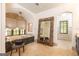 Bright, tiled bathroom featuring a soaking tub under a window, and a large mirror at 4421 Paradise Cir, Vinings, GA 30339