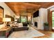 Spacious main bedroom with a wooden ceiling, stone fireplace, and hardwood floors at 4421 Paradise Cir, Vinings, GA 30339