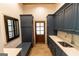 Well-organized mud room with blue cabinetry, bench seating, and a convenient sink at 4421 Paradise Cir, Vinings, GA 30339