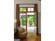 View through french doors to a covered outdoor patio and seating area at 4421 Paradise Cir, Vinings, GA 30339