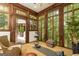 Cozy sunroom with wood-framed windows offering serene outdoor views at 4421 Paradise Cir, Vinings, GA 30339