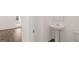 This bathroom features a white pedestal sink and toilet at 624 Kimberwick Dr, Locust Grove, GA 30248