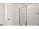 Bathroom featuring glass shower with a shower head and built-in shelves at 624 Kimberwick Dr, Locust Grove, GA 30248