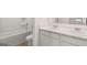 Bathroom features double sink vanity with drawers and cabinets, and a tub/shower combo at 624 Kimberwick Dr, Locust Grove, GA 30248