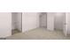 Bright bedroom with carpet flooring, bathroom, and a closet at 624 Kimberwick Dr, Locust Grove, GA 30248
