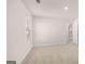 This bedroom has neutral carpet, white walls and trim, and windows for natural light at 624 Kimberwick Dr, Locust Grove, GA 30248