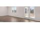 This entryway offers hardwood floors, neutral paint, and access to the outdoors at 624 Kimberwick Dr, Locust Grove, GA 30248