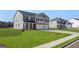 Beautiful two-story home with a well-maintained lawn, and a three car garage at 624 Kimberwick Dr, Locust Grove, GA 30248
