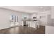 Open-concept kitchen featuring white cabinets and stainless steel appliances at 624 Kimberwick Dr, Locust Grove, GA 30248