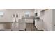 Bright kitchen with white cabinets, granite countertops, stainless steel appliances, and an island for entertaining at 624 Kimberwick Dr, Locust Grove, GA 30248
