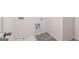 Functional laundry area with tile floors and white trim at 624 Kimberwick Dr, Locust Grove, GA 30248