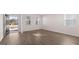 Sunlit living room with wood flooring and view of the exterior at 624 Kimberwick Dr, Locust Grove, GA 30248