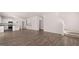 Open-concept living space connecting a modern kitchen to the comfortable living area at 624 Kimberwick Dr, Locust Grove, GA 30248