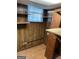 Basement area with wood paneled walls, shelving, and a window providing natural light at 4935 Liberty Sw Ct, Stone Mountain, GA 30087