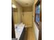 Bathroom with large mirror, window, and a tub shower at 4935 Liberty Sw Ct, Stone Mountain, GA 30087