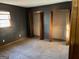 Dark-walled bedroom featuring two closets and natural light at 4935 Liberty Sw Ct, Stone Mountain, GA 30087