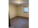 Bedroom with carpet, and a window with curtains at 4935 Liberty Sw Ct, Stone Mountain, GA 30087