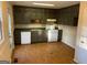 Functional kitchen with white appliances and ample cabinet space at 4935 Liberty Sw Ct, Stone Mountain, GA 30087