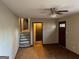 Living room with windows and hardwood-style flooring with stairs leading to the upper floor at 4935 Liberty Sw Ct, Stone Mountain, GA 30087