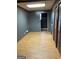 A room featuring grey painted walls and wood look floors, next to shuttered closet at 4935 Liberty Sw Ct, Stone Mountain, GA 30087