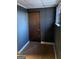 Small room featuring dark walls and wood-look floors at 4935 Liberty Sw Ct, Stone Mountain, GA 30087